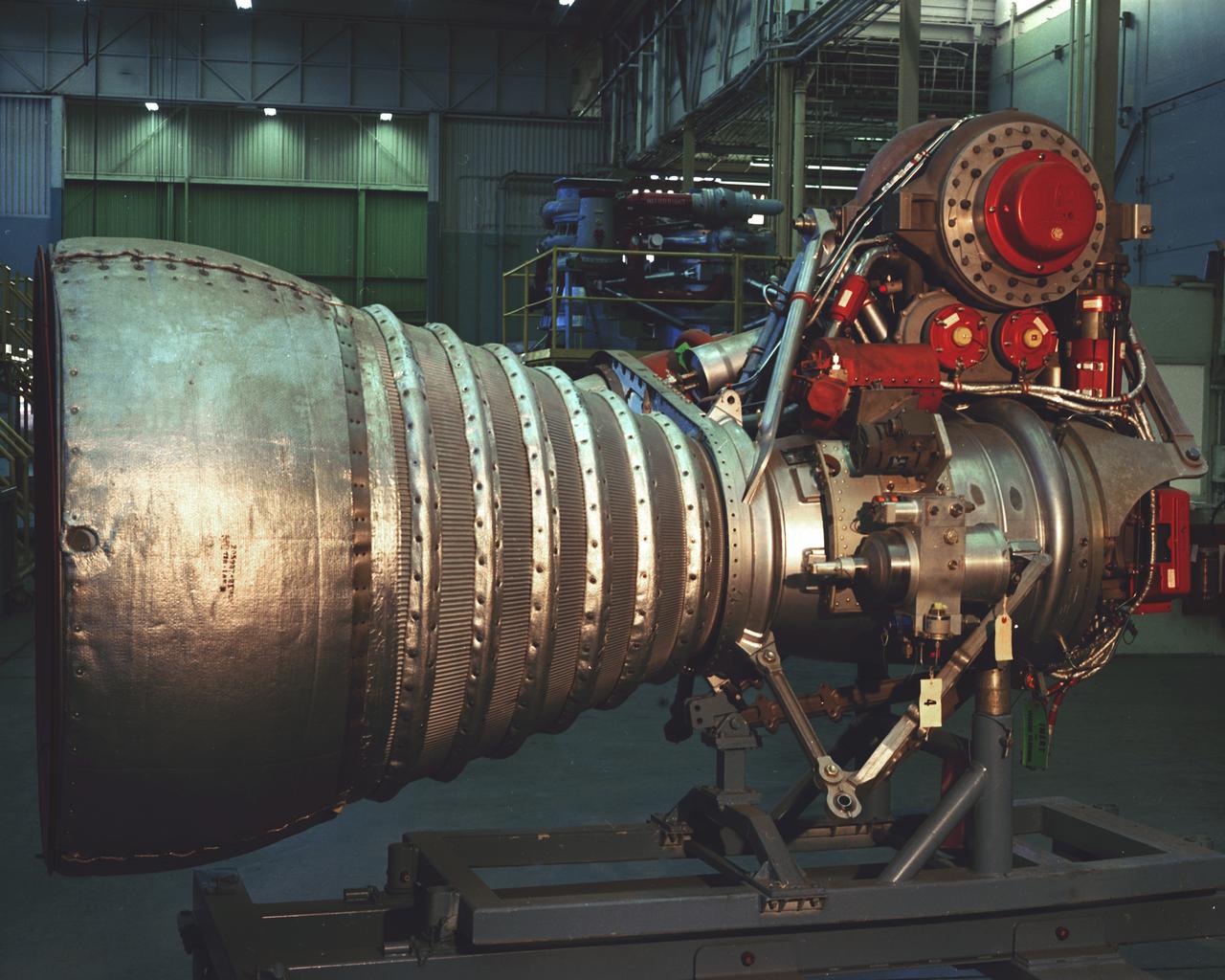 A cluster of eight H-1 engines were used to thrust the first stage of Saturn I (S-I stage) and Saturn IB (S-IB stage). The engines were arranged in a double pattern. Four engines, located inboard, were fixed in a square pattern around the stage axis, while the remaining four engines were located outboard in a larger square pattern and each outer engine was gimbaled. Each H-1 engine, fueled with liquid oxygen (LOX) and kerosene (RP-1), initially had a thrust of 188,000 pounds each for a combined thrust of over 1,500,000 pounds. Later, the H-1 engine was upgraded to 205,000 pounds of thrust and a combined total thrust of 1,650,000 pounds for the Saturn IB program. This photo depicts a single modified H-1 engine. The H-1 engine was developed under the direction of Marshall Space Flight Center (MSFC). 