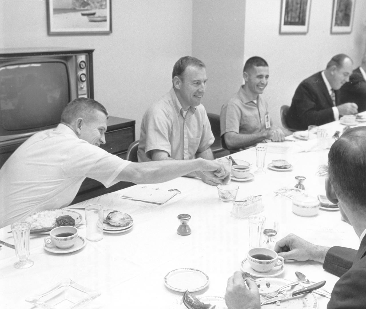 Pictured (left to right) are Apollo 8 crew members Frank Borman, commander; James Lovell, Command Module (CM) pilot; and William Anders, Lunar Module (LM) pilot, having breakfast on the day of launch. The three composed the first manned Apollo mission that launched aboard the Saturn V and the first manned Apollo craft to enter lunar orbit. Apollo 8 mission lift off occurred on December 21, 1968 and returned safely to Earth on December 27, 1968. The mission achieved operational experience and tested the Apollo command module systems, including communications, tracking, and life-support, in cis-lunar space and lunar orbit, and allowed evaluation of crew performance on a lunar orbiting mission. The crew photographed the lunar surface, both far side and near side, obtaining information on topography and landmarks as well as other scientific information necessary for future Apollo landings. All systems operated within allowable parameters and all objectives of the mission were achieved.
