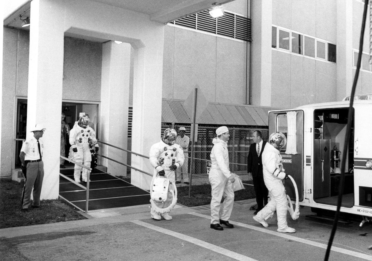 KENNEDY SPACE CENTER, FLA. -- Apollo 7 astronauts enter transfer van, which transported them to Cape Kennedy's Launch Complex 34 and their Saturn IB space vehicle that lifted off at 11:03 a.m. EDT, Oct. 11, 1968. First to enter the transfer van was Donn F. Eisele, command module pilot, followed by Walter Cunningham, lunar module pilot, and Walter M. Schirra Jr., Apollo 7 commander. The space pilots are scheduled to orbit the Earth 11 days, gathering information for future lunar voyages directed by the National Aeronautics and Space Administration.
