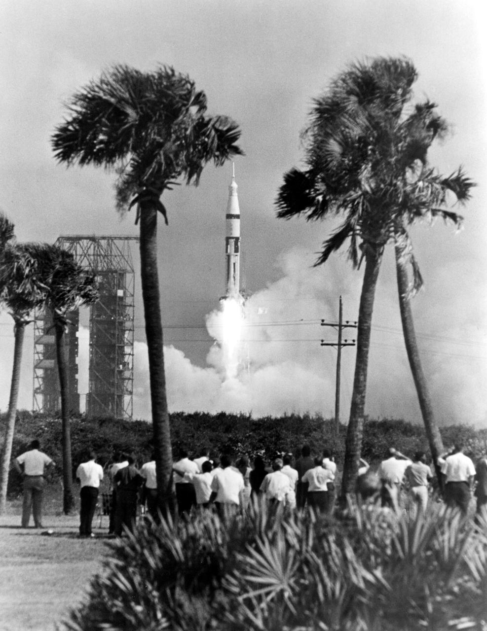 KENNEDY SPACE CENTER, FLA. -- Workers at Cape Kennedy watched a 224-foot-high Saturn 1B space vehicle lift off today from Complex 34 carrying Apollo 7 astronauts Walter M. Schirra Jr., Donn F. Eisele and Walter Cunningham at the start of their scheduled 11-day Earth orbital flight.