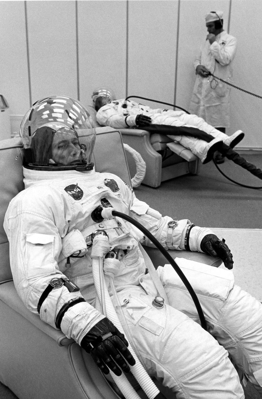 KENNEDY SPACE CENTER, FLA. -- Apollo 7 astronauts Donn F. Eisele, foreground, and Walter Cunningham, rear, undergo spacesuit checks today prior to their Earth orbital mission with Walter M. Schirra Jr., not shown. The three space pilots lifted off atop a Saturn 1B space vehicle from Cape Kennedy's Launch Complex 34 at 11:03 a.m. EDT, Oct. 11, 1968. The National Aeronautics and Space Administration's first manned Apollo flight is designed to verify spacecraft systems for future lunar voyages.