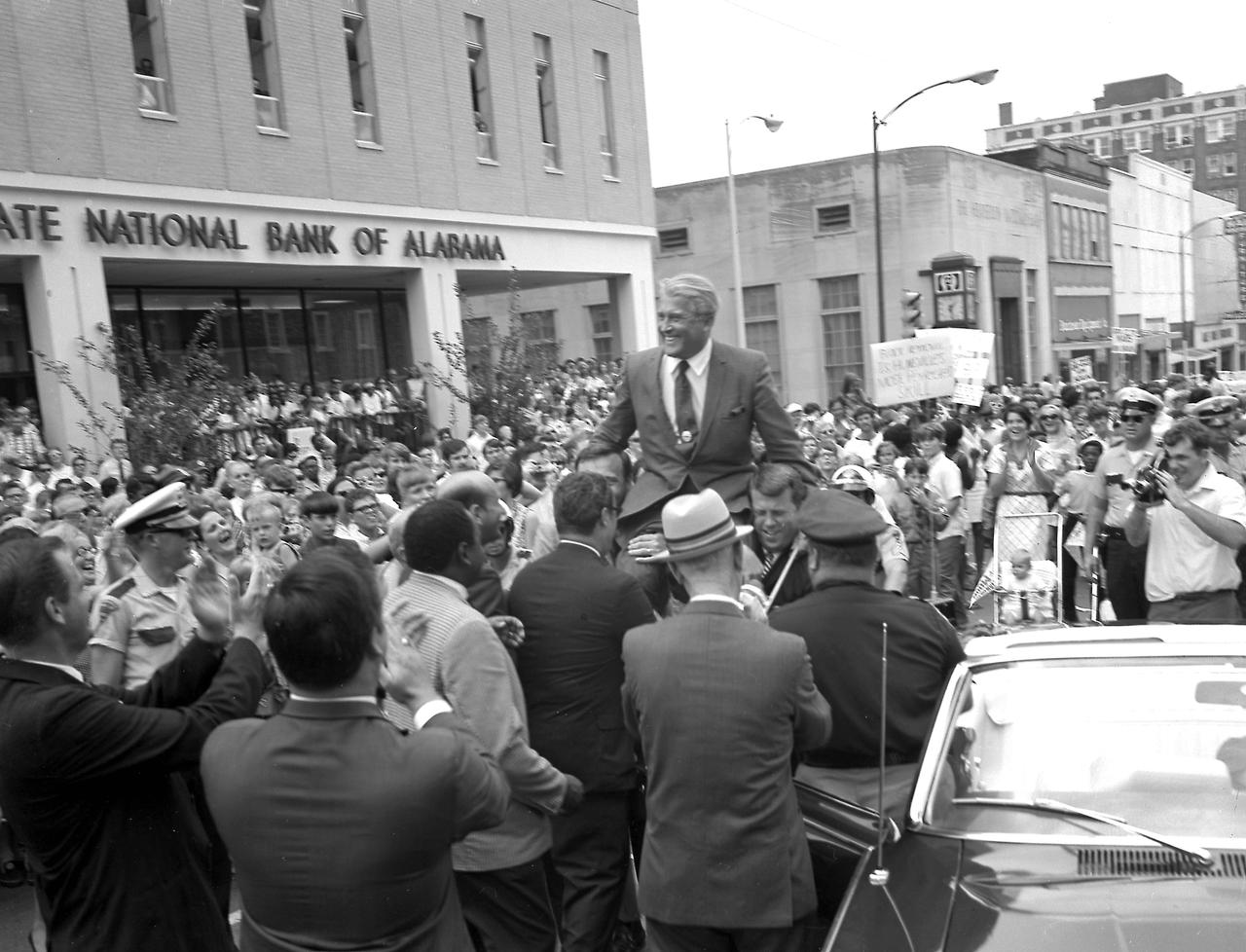 Dr. von Braun is carried aloft on the shoulders of Huntsville city officials during the Apollo 11 celebration in Huntsville, Alabama, on July 24, 1969. Huntsville, Alabama is the home of the Marshall Space Flight Center which developed the Saturn vehicles under the direction of Dr. von Braun. The Apollo 11 lifted off in July and made the first marned lunar landing on the Moon. 