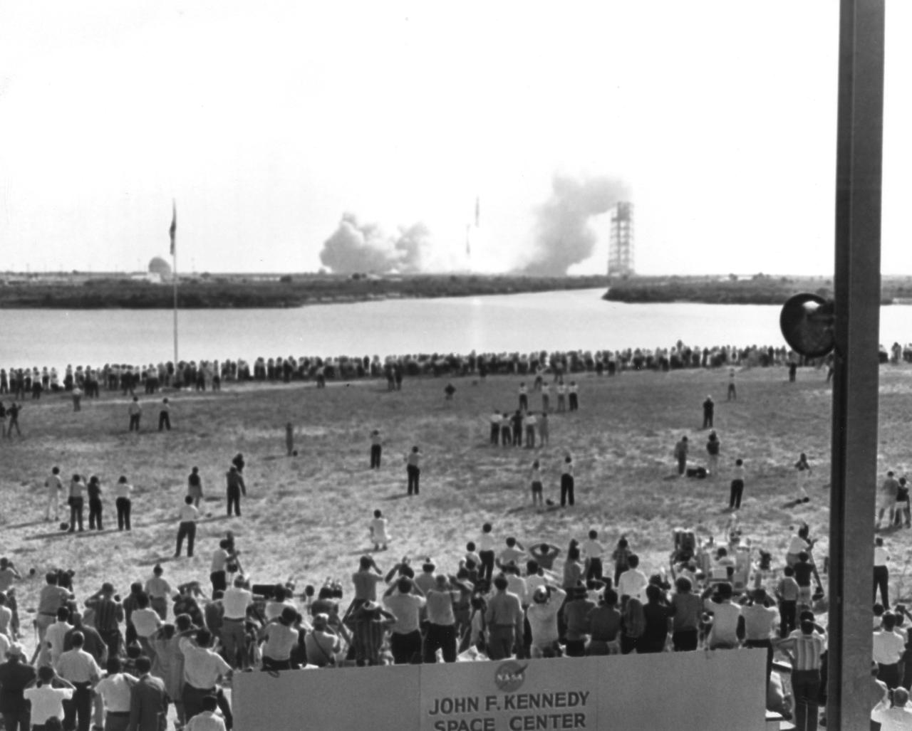At the press site, thousands of news reporters from the world over watched, taking many pictures, as the  Saturn V launch vehicle (AS-506) lifted off to start Apollo 11 on its historic mission to land on the Moon. The total number of news people officially registered to cover the launch was 3,497. The craft lifted off from launch pad 39 at Kennedy Space Flight Center (KSC) on July 16, 1969. A three man crew included astronauts Neil A. Armstrong, commander; Michael Collins, Command Module(CM) pilot; and Edwin E. Aldrin Jr., Lunar Module (LM) pilot. The mission finalized with splashdown into the Pacific Ocean on July 24, 1969. With the success of Apollo 11, the national objective to land men on the Moon and return them safely to Earth had been accomplished. The Saturn V was developed by the Marshall Space Flight Center (MSFC) under the direction of Werher von Braun.