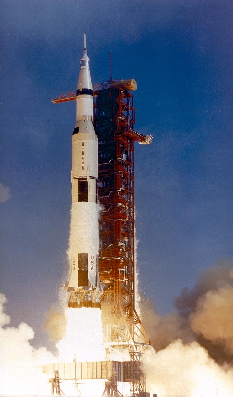 This photograph shows the Saturn V launch vehicle (SA-506) for the Apollo 11 mission liftoff at 8:32 am CDT, July 16, 1969, from launch complex 39A at the Kennedy Space Center. Apollo 11 was the first manned lunar landing mission with a crew of three astronauts: Mission commander Neil A. Armstrong, Command Module pilot Michael Collins, and Lunar Module pilot Edwin E. Aldrin, Jr. It placed the first humans on the surface of the moon and returned them back to Earth. Astronaut Armstrong became the first man on the lunar surface, and astronaut Aldrin became the second. Astronaut Collins piloted the Command Module in a parking orbit around the Moon. 
