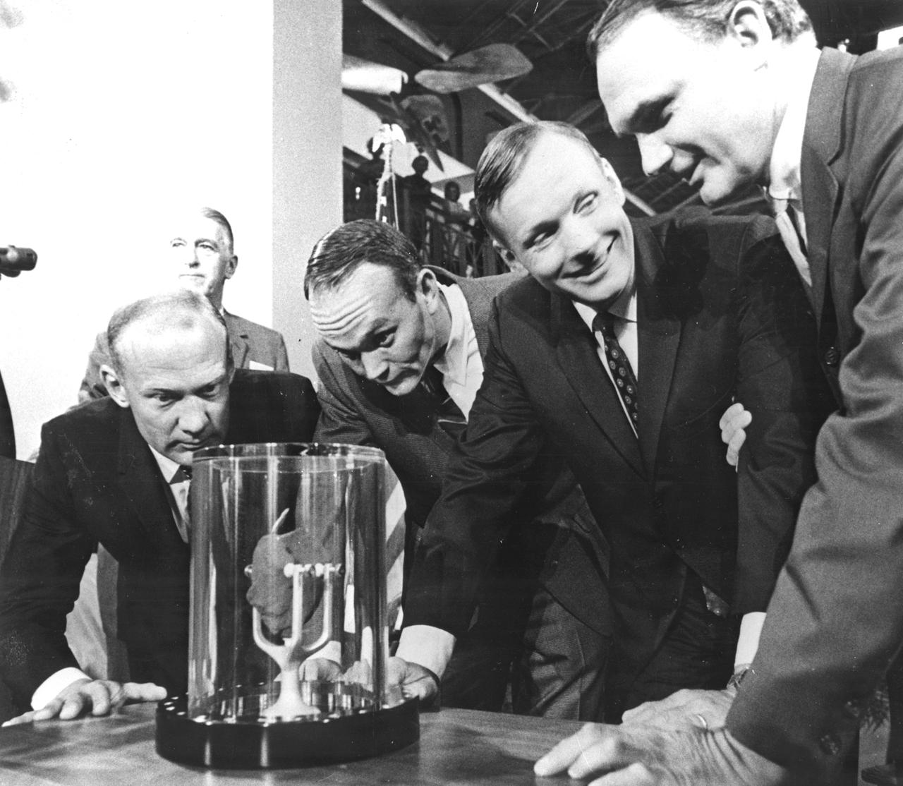 Apollo 11 astronauts, (left to right) Edwin E. Aldrin Jr., Lunar Module pilot; Michael Collins, Command Module pilot; and Neil A. Armstrong, commander, are showing a two-pound Moon rock to Frank Taylor, director of the Smithsonian Institute in Washington D.C.  The rock was picked up from the Moon’s surface during the Extra Vehicular Activity (EVA) of Aldrin and Armstrong following man’s first Moon landing and was was presented to the Institute for display in the Art and Industries Building. The Apollo 11 mission, launched from the Kennedy Space Center, Florida via the Marshall Space Flight Center (MSFC) developed Saturn V launch vehicle on July 16, 1969 and safely returned to Earth on July 24, 1969. With the success of Apollo 11, the national objective to land men on the Moon and return them safely to Earth had been accomplished. 