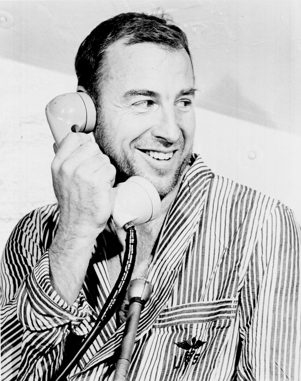 Apollo 8 Astronaut James Lovell, Command Module (CM) pilot of the first manned Saturn V space flight into Lunar orbit, accepted a phone call from the U.S. President Lyndon B. Johnson prior to launch. Lovell, along with astronauts William Anders, Lunar Module (LM) pilot, and Frank Borman, commander, launched aboard the Apollo 8 mission on December 21, 1968 and returned safely to Earth on December 27, 1968. The mission achieved operational experience and tested the Apollo command module systems, including communications, tracking, and life-support, in cis-lunar space and lunar orbit, and allowed evaluation of crew performance on a lunar orbiting mission. The crew photographed the lunar surface, both far side and near side, obtaining information on topography and landmarks as well as other scientific information necessary for future Apollo landings. All systems operated within allowable parameters and all objectives of the mission were achieved.