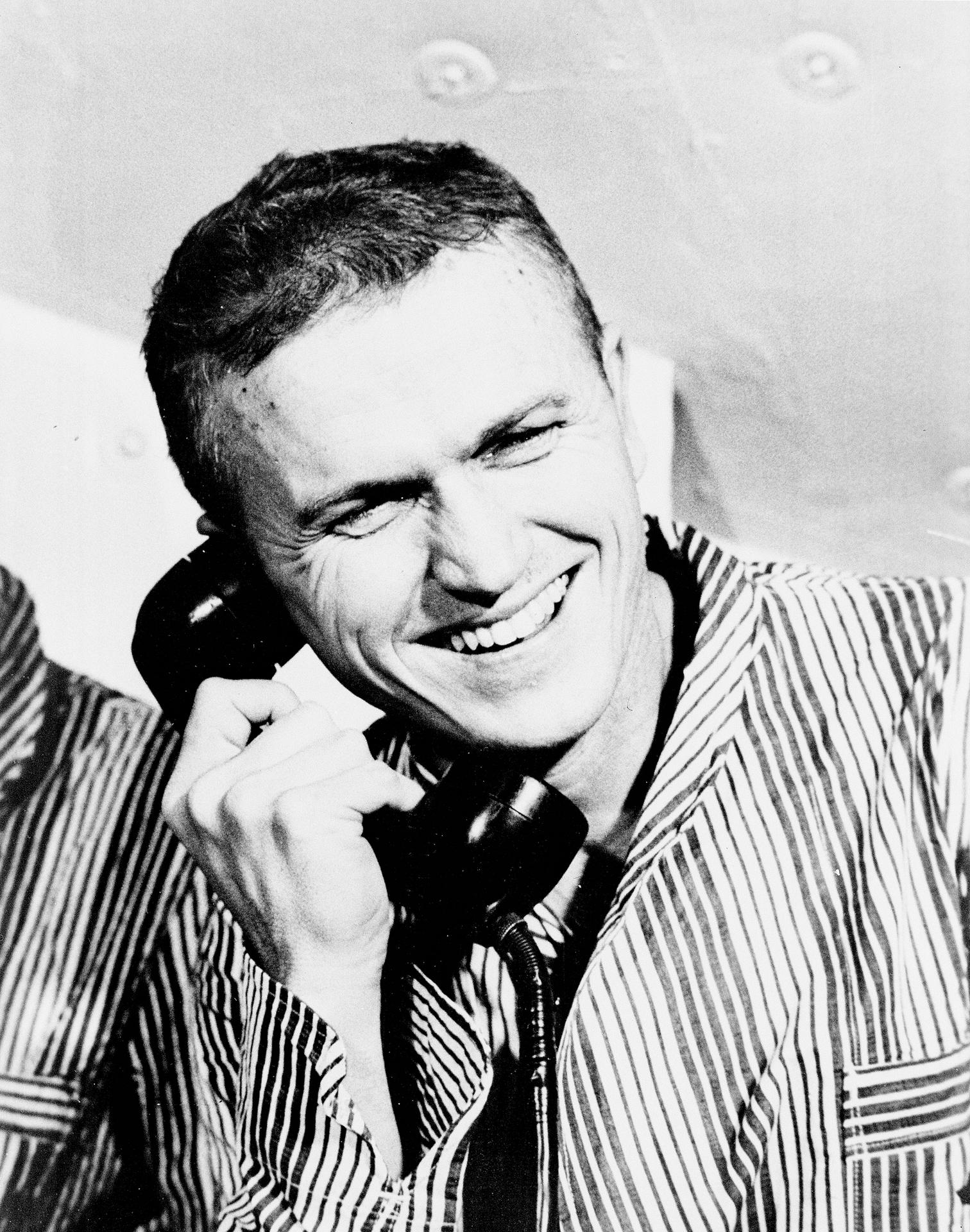 Frank Borman talks on a phone after his Apollo 8 flight