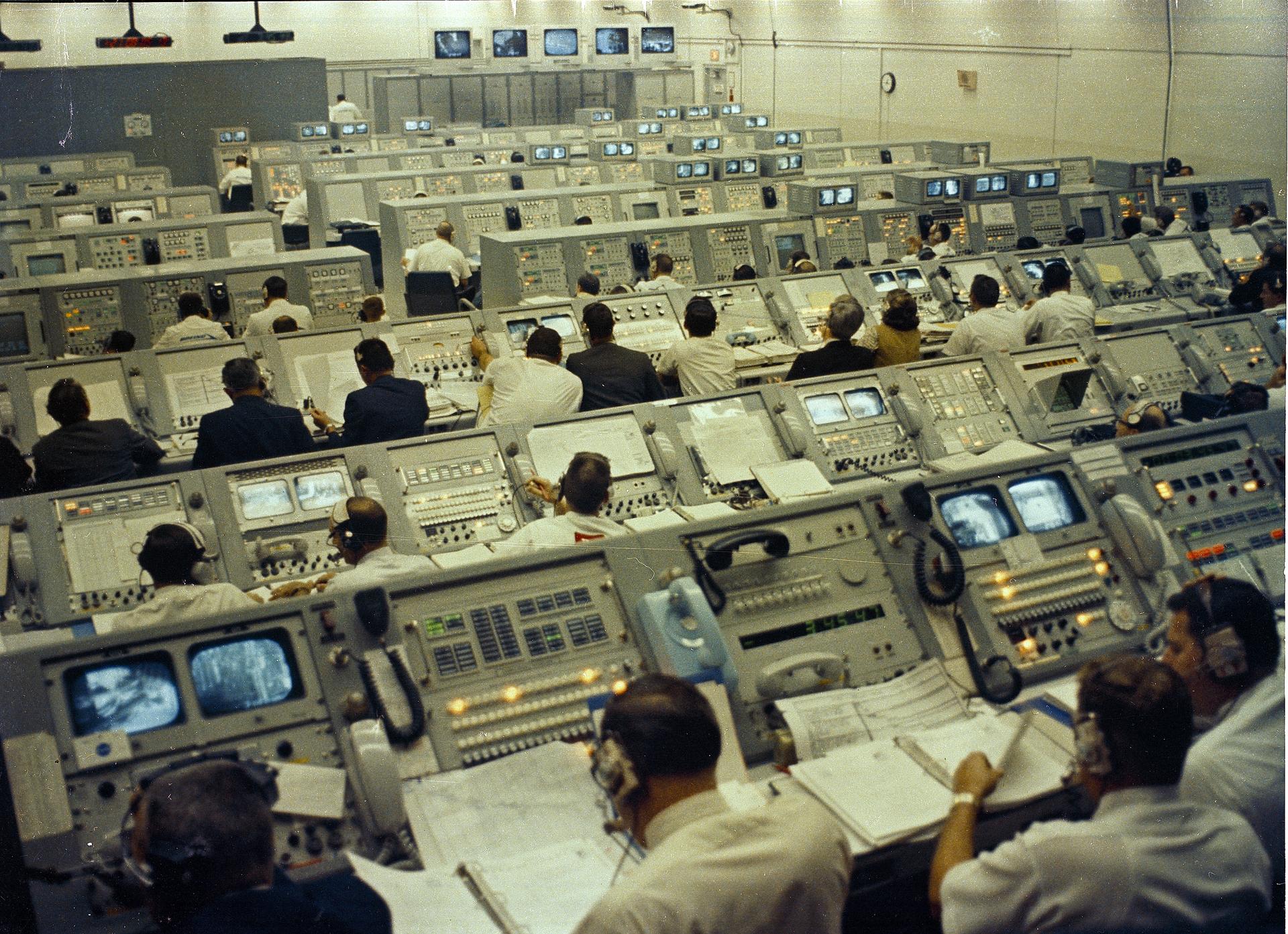 Flight controllers work in the Launch Control Center at KSC during the Apollo 8 mission