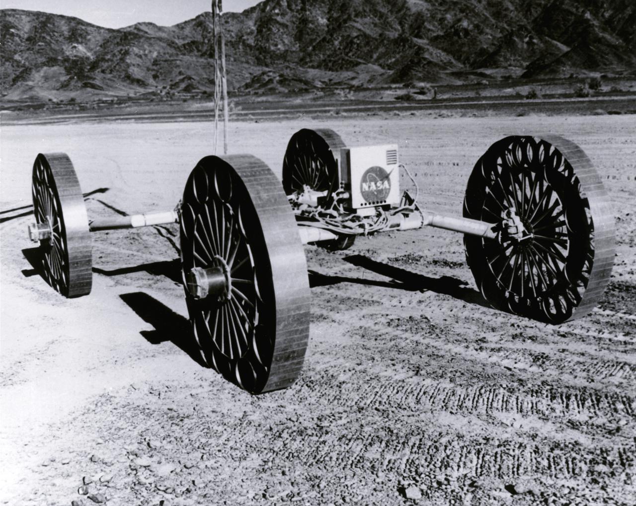 This Mobility Test Article (MTA), built by the Bendix Corporation for NASA’s Marshall Space Flight Center (MSFC), was driven over rocks in Arizona.  The data provided by the MTA helped in designing the Lunar Roving Vehicle (LRV), developed under the direction of the MSFC. The LRV was designed to allow Apollo astronauts a greater range of mobility during lunar exploration missions. 