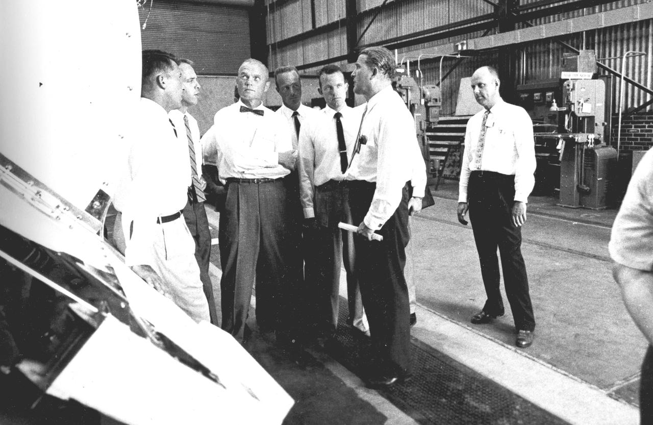 Five of the seven original astronauts are seen with Dr. von Braun inspecting the Mercury-Redstone hardware in the Fabrication Laboratory of Army Ballistic Missile Agency (ABMA) in 1959. Left to right: Astronauts Walter Schirra, Alan Shepard, John Glenn, Scott Carpenter, Gordon Cooper, and Dr. von Braun.