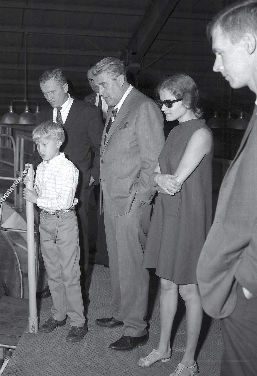 (L to R) Peter von Braun; Astronaut Frank Borman; M.P.Siebel; Dr. von Braun; Tris von Braun at the MSFC Neutral Buoyancy Simulator (NBS).