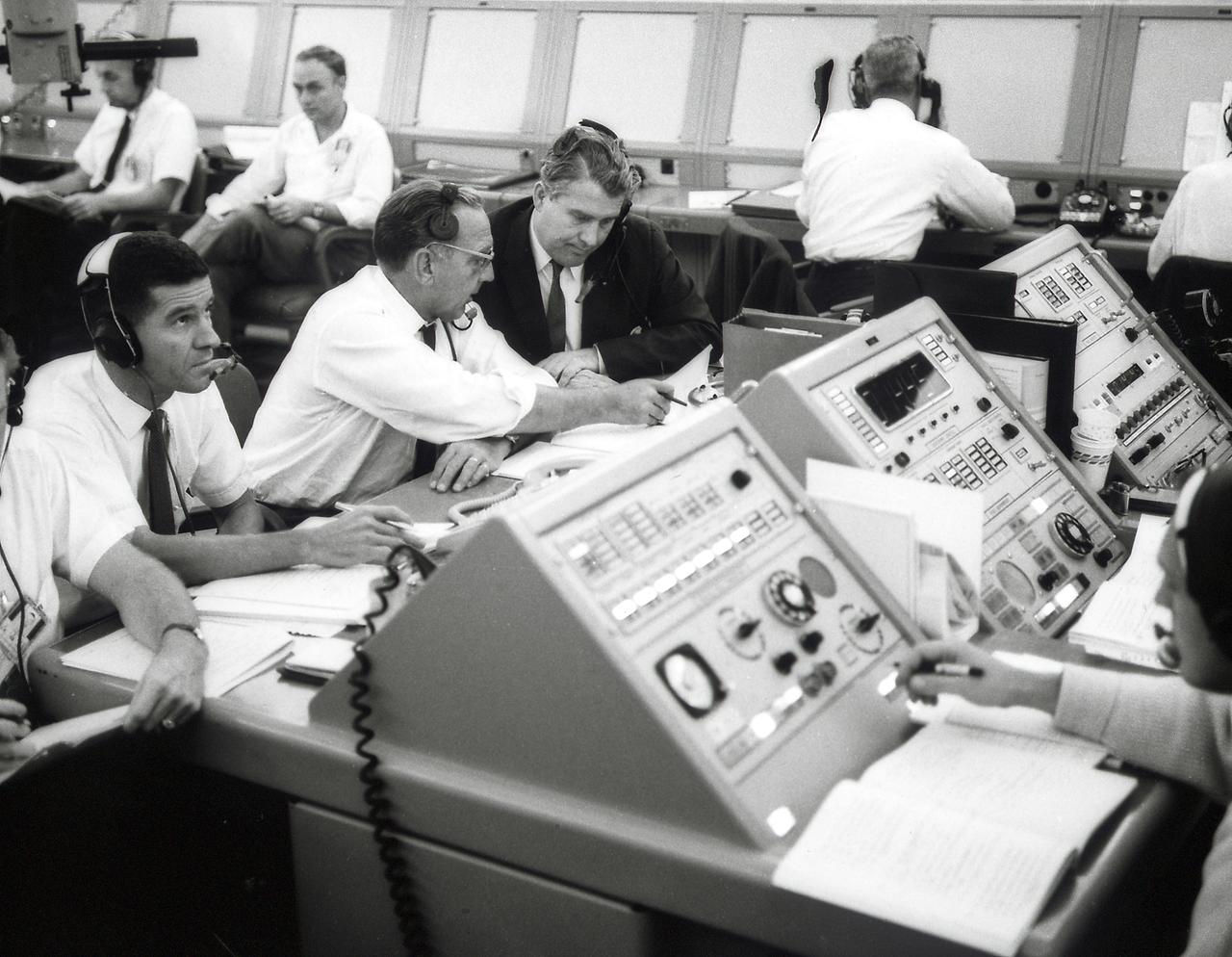 Dr. von Braun, Director of the Marshall Space Flight Center (MSFC), and Dr. Debus, Director of Launch Operations Directorate, photographed in the blockhouse during the Apollo launch simulation.