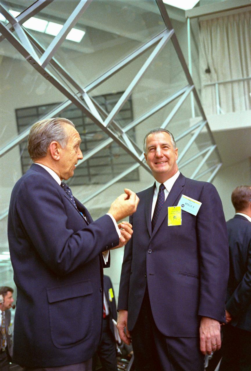 KENNEDY SPACE CENTER, FLA. -- Within the Launch Control Center, Vice President Spiro T. Agnew listens to Dr. Kurt H. Debus, director, Kennedy Space Center, explain highlights of the Apollo Program. The Vice President viewed the launch of Apollo 9 astronauts James A. McDivitt, David R. Scott and Russell L. Schweickart today. They were sent on a planned 10-day Earth orbital flight to put a lunar module spacecraft through extensive tests to qualify it for a possible manned lunar landing later this year. The National Aeronautics and Space Administration directs the Apollo Program.
