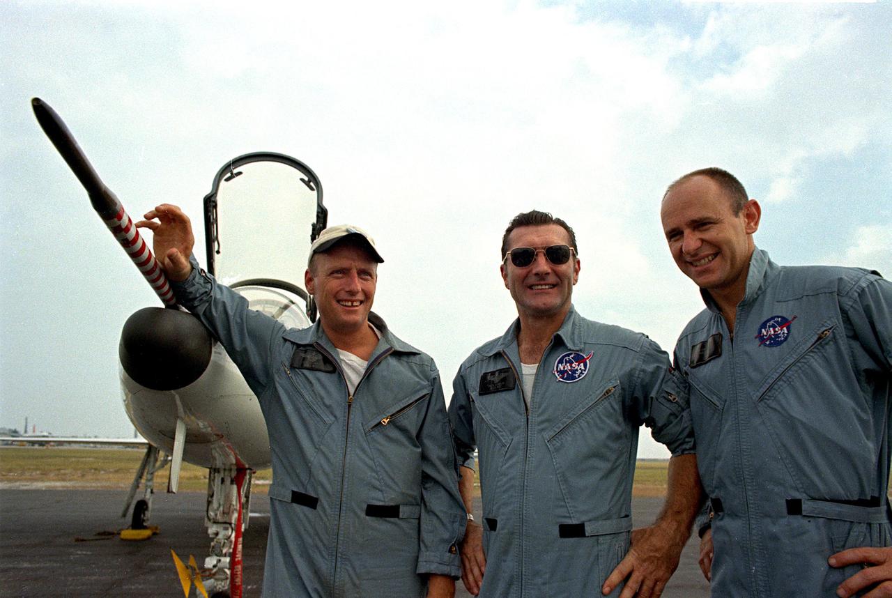 KENNEDY SPACE CENTER, FLA. - The Apollo 12 astronauts, left to right, Charles Conrad Jr., Richard F. Gordon, and Alan L. Bean, pose in front of a NASA T-38 training aircraft at Patrick Air Force Base.  Eacht astronaut piloted his own T-38, performing aerobatics in preparation for their mission, the second manned lunar landing.