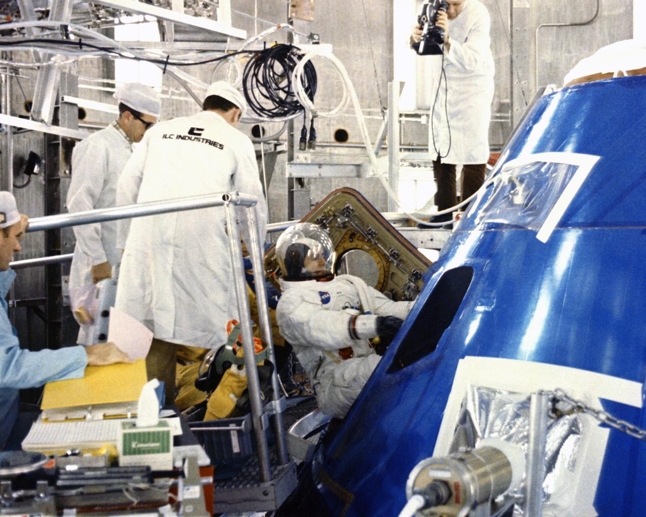 CAPE CANAVERAL, Fla. -- Apollo 12 Lunar Module pilot Alan L. Bean enters spacecraft in preparation for altitude chamber test with mission commander Charles Conrad Jr. and Richard F. Gordon Jr., command module pilot.  Air was pumped out of the chamber to simulate a space environment.  The Apollo 12 astronauts are scheduled to perform the nation’s second manned lunar landing.   Photo credit: NASA