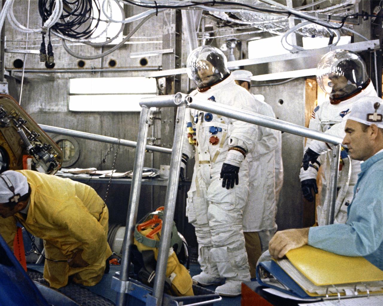 CAPE CANAVERAL, Fla. -- Apollo 12 lunar module pilot Alan L. Bean enters spacecraft in preparation for altitude chamber test with mission commander Charles Conrad Jr. and Richard F. Gordon Jr., command module pilot.  Air was pumped out of the chamber to simulate a space environment.  The Apollo 12 astronauts are scheduled to perform the nation’s second manned lunar landing.   Photo credit: NASA