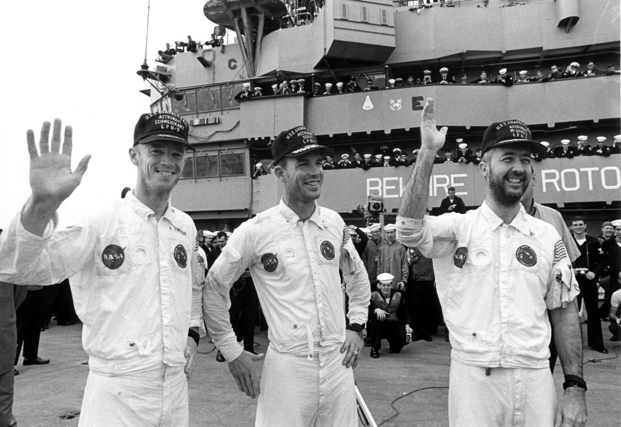 KENNEDY SPACE CENTER, FLA. -- Wearing flight caps presented to them by the crew of the USS Guadalcanal, bearded Apollo 9 astronauts (left to right) Russell L. Schweickart, David R. Scott and James A. McDivitt, wave to well-wishers aboard the recovery ship at the completion of their 10-day Earth orbital mission. Their spacecraft splashed down 780 nautical miles southeast of Cape Kennedy at 12:01 p.m. EST, March 13, 1969. During the textbook mission, the space pilots verified a lunar module spacecraft similar to the one that is to land Americans on the Moon later this year. Their flight began March 3 when they were launched by an Apollo_Saturn V rocket from the Kennedy Space Center. The National Aeronautics and Space Administration directs the Apollo program.