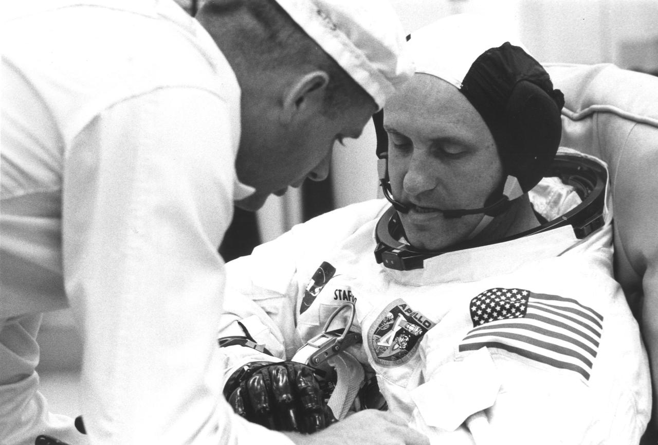 KENNEDY SPACE CENTER, FLA. -- A technician helps astronaut Thomas P. Stafford, Apollo 10 commander, suit up for the Countdown Demonstration Test (CDDT) which ended successfully at 1:01 p.m. today. The CDDT is a dress rehearsal for the launch of Apollo 10 from Pad B at Launch Complex 39 May 18 at 12:49 p.m.
