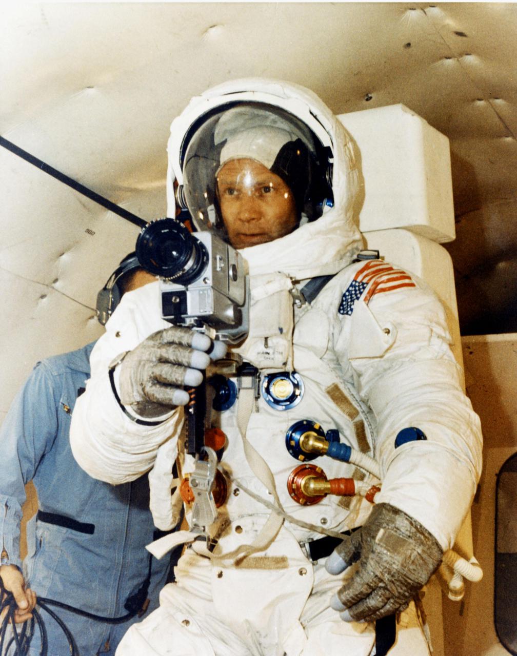 JOHNSON SPACE CENTER, HOUSTON, TEXAS - Flying in a KC-135 aircraft, Apollo 11 Lunar Module Pilot Edwin E. Aldrin Jr. takes pictures during training for the upcoming first manned lunar landing with astronauts Neil A. Armstrong Jr. and Michael Collins.