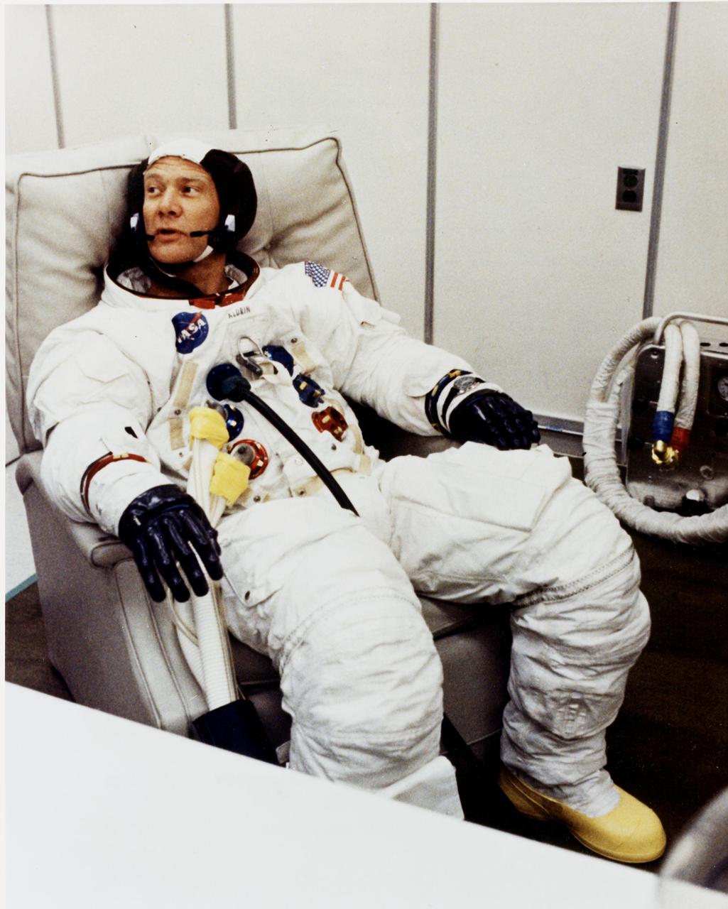 KENNEDY SPACE CENTER, FLA. - Apollo 11 Lunar Module Pilot Edwin E. Aldrin Jr. relaxes after suiting up to participate in a space vehicle Countdown Demonstration Test with astronauts Neil A. Armstrong and Michael Collins. They will be launched on a lunar landing mission.