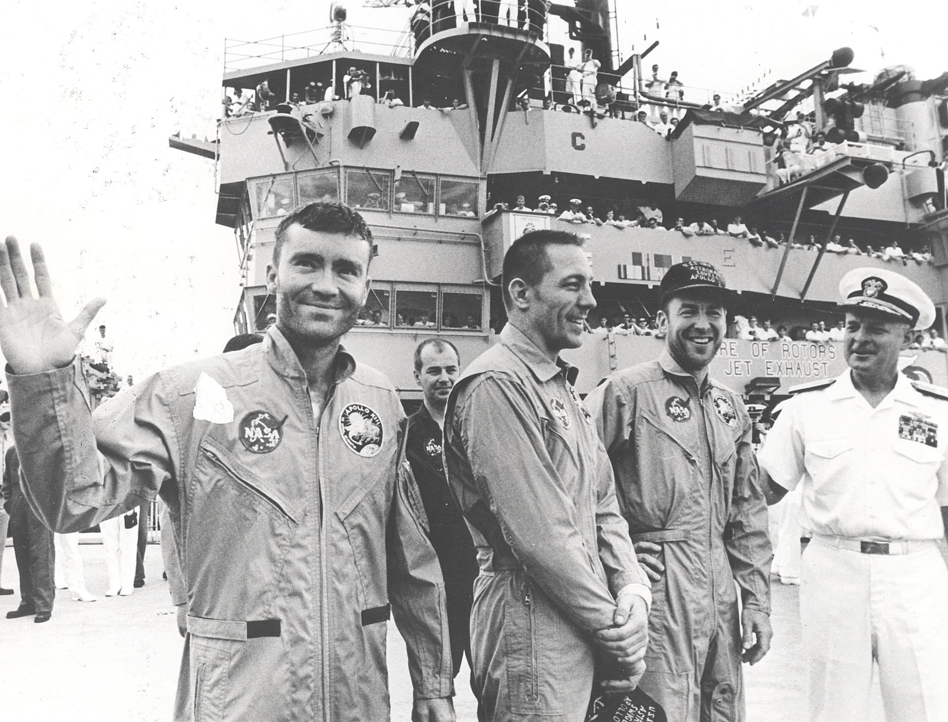 Apollo 13 astronauts Fred Haise, John Swigert, and James Lovell aboard the recovery ship, USS Iwo Jima after safely touching down in the Pacific Ocean at the end of their ill-fated mission.