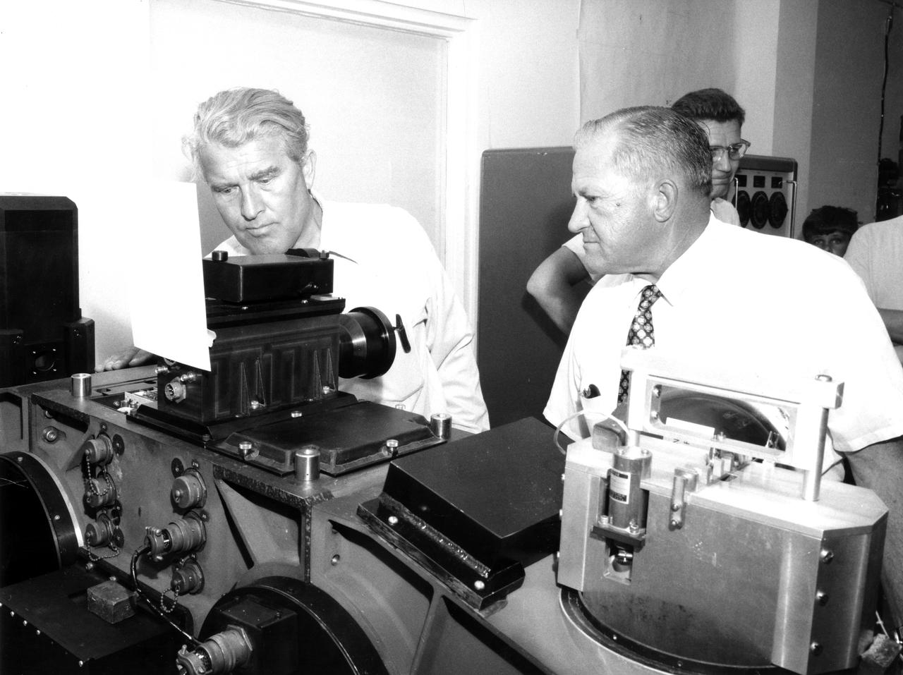 This photograph was taken after Dr. von Braun moved from his post as Director of the Marshall Space Flight Center (MSFC) to Deputy Associate Administrator for Planning at NASA Headquarters. On June 27, 1970, he visited the MSFC again during the center’s 10th anniversary to look at a mockup of the spacecraft that would later be known as Skylab. In this photograph, von Braun (left) and Fred W. Kelley examine an ST-100 stellar instrument platform in MSFC’s Astrionics Lab.