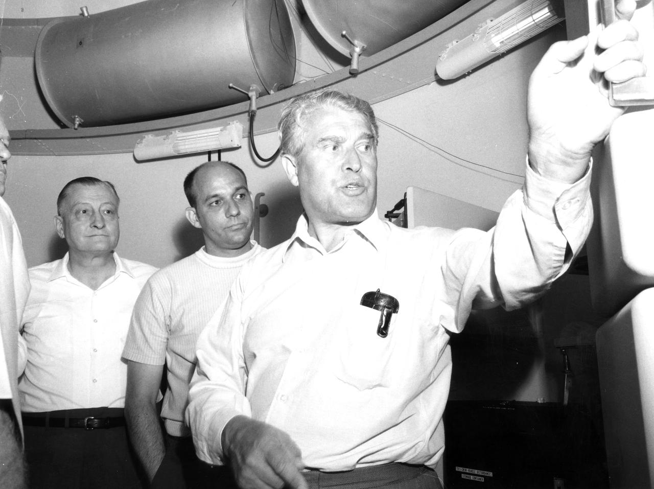 This photograph was taken after Dr. von Braun moved from his post as Director of the Marshall Space Flight Center (MSFC) to Deputy Associate Administrator for Planning at NASA Headquarters. On June 27, 1970, he visited the MSFC again during the center’s 10th anniversary to look at a mockup of the spacecraft that would later be known as Skylab.  With von Braun are (left to right):  Herman K. Weidner, director of Science and Engineering at MSFC, and James R. Thompson of the center’s Astrionics Laboratory.