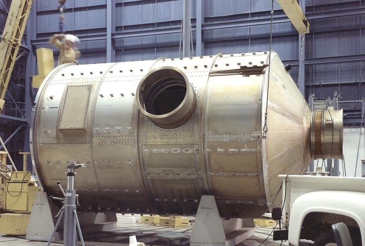 At Marshall Space Flight Center, Skylab's Multiple Docking Adapter (MDA) flight article undergoes center-of-gravity testing. Developed and fabricated by MSFC, the MDA housed the control units for the Apollo Telescope Mount (ATM), Earth Resources Experiment Package (EREP), and the Zero-Gravity Material Processing Facility and provided a docking port for the Apollo Command Module.
