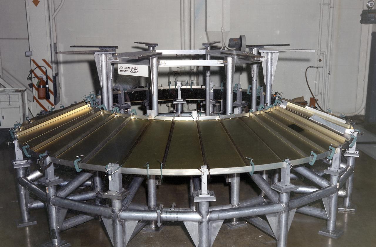 The Apollo Telescope Mount (ATM) was designed and developed by the Marshall Space Flight Center and served as the primary scientific instrument unit aboard Skylab (1973-1979). The ATM consisted of eight scientific instruments as well as a number of smaller experiments. One scientific instrument was the ATM solar shield that formed the base for the rack/frame instrument and the instrument canister. The solar shield contained aperture doors for each instrument to protect against solar radiation and space contamination.