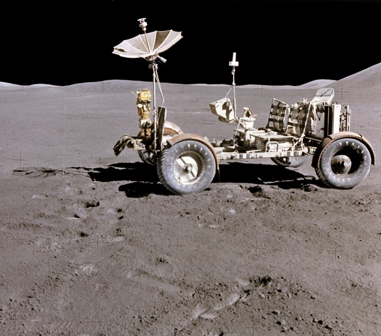 This photograph of the Lunar Roving Vehicle (LRV) was taken during the Apollo 15 mission. Powered by battery, the lightweight electric car greatly increased the range of mobility and productivity on the scientific traverses for astronauts. It weighed 462 pounds (77 pounds on the Moon) and could carry two suited astronauts, their gear and cameras, and several hundred pounds of bagged samples. The LRV's mobility was quite high. It could climb and descend slopes of about 25 degrees. The LRV was designed and developed by the Marshall Space Flight Center and built by the Boeing Company. 