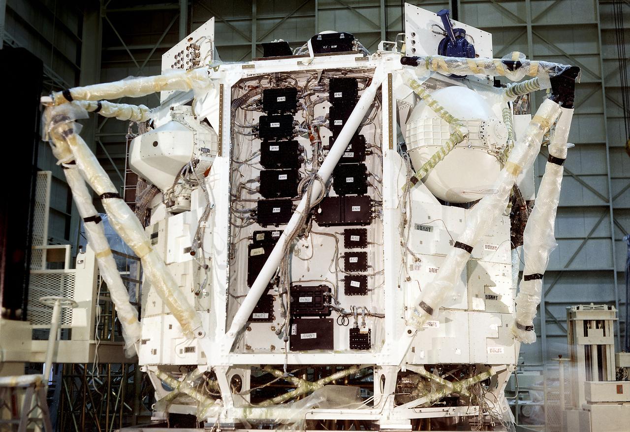 The Apollo Telescope Mount (ATM) was designed and developed by the Marshall Space Flight Center and served as the primary scientific instrument unit aboard Skylab (1973-1979). The ATM consisted of eight scientific instruments as well as a number of smaller experiments. This is a photograph of the assembly of an ATM flight unit rack. The flight unit rack was an octagonal shaped complex outer frame that housed the canister containing the solar instruments.