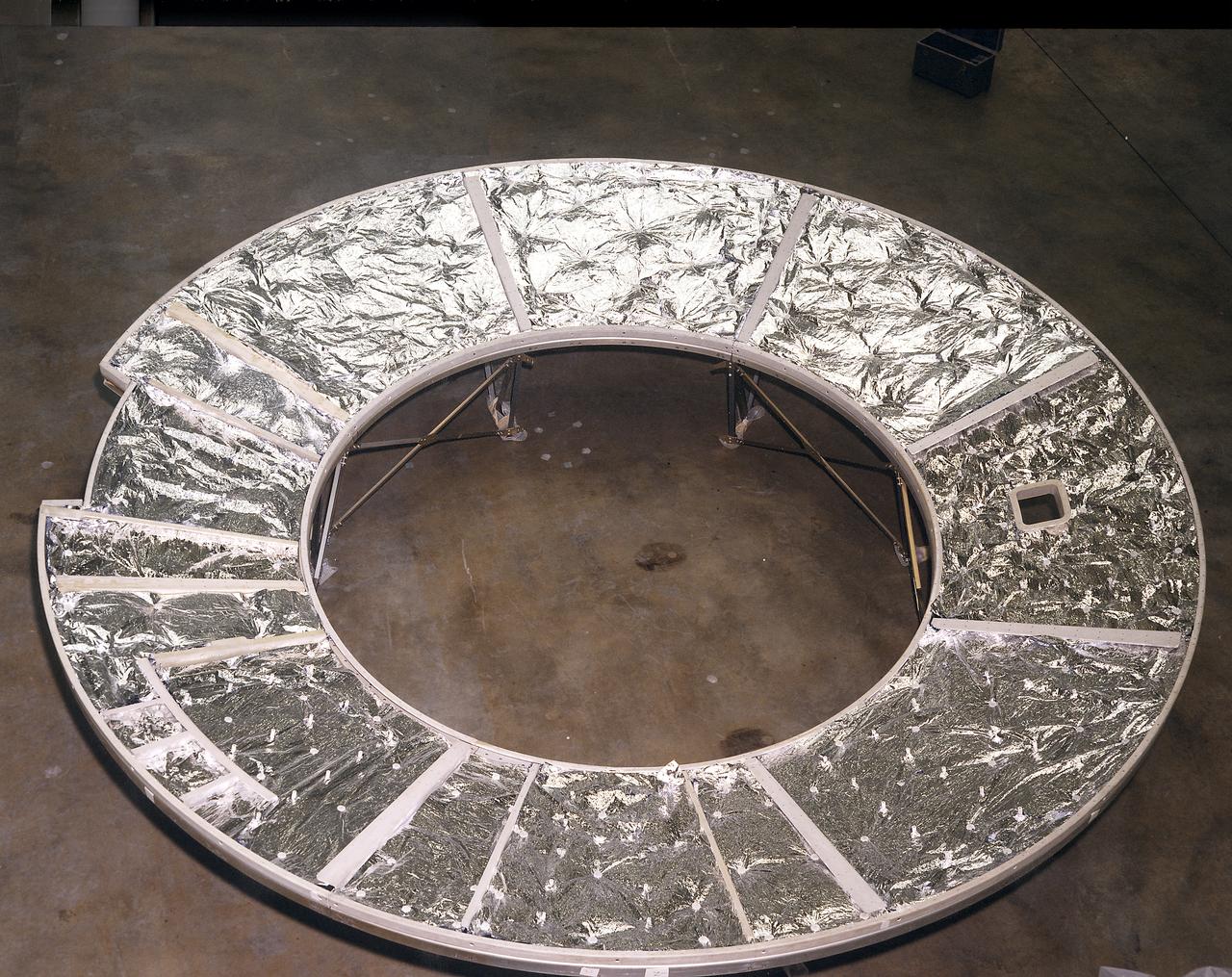 The Apollo Telescope Mount (ATM) was designed and constructed at the Marshall Space Flight Center and served as the primary scientific instrument unit aboard Skylab. The ATM consisted of eight scientific instruments as well as a number of smaller experiments. This photograph shows the flight unit solar shield for the ATM that formed the base for the rack, a complex frame, and the canister that contained the instruments. 