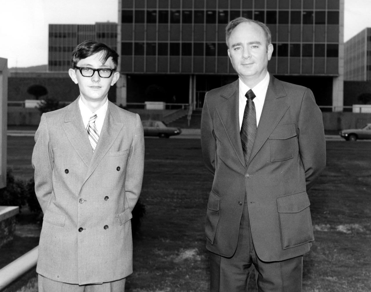W. Brain Dunlap (left), high school student from Youngstown, Ohio, is pictured here with Harry Coons of the Marshall Space Flight Center (MSFC) during a visit to the center. Dunlap was among 25 winners of a contest in which some 3,500 high school students proposed experiments for the following year’s Skylab mission. The nationwide scientific competition was sponsored by the National Science Teachers Association and the National Aeronautics and Space Administration (NASA). The winning students, along with their parents and sponsor teachers, visited MSFC where they met with scientists and engineers, participated in design reviews for their experiments, and toured MSFC facilities. Of the 25 students, 6 did not see their experiments conducted on Skylab because the experiments were not compatible with Skylab hardware and timelines. Of the 19 remaining, 11 experiments required the manufacture of additional equipment. 