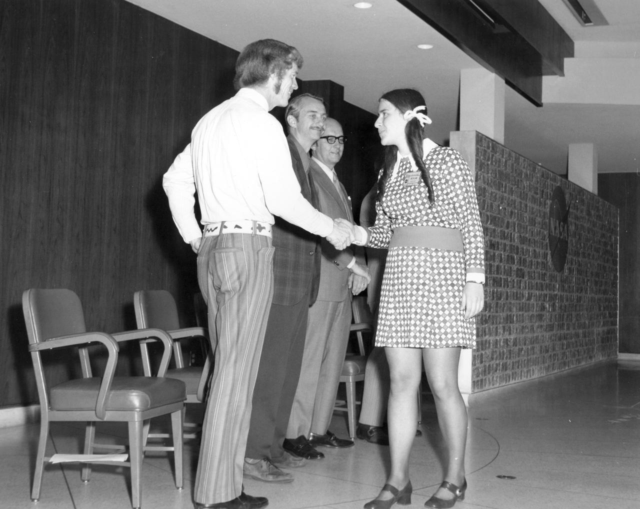 Berkley, California high school student, Jeanne L. Leventhal, is greeted by (left to right): Astronauts Russell L. Schweickart, and Owen K. Garriott; and Marshall Space Flight Center (MSFC) Skylab Program Manager, Leland Belew during a tour of MSFC. Leventhal was among 25 winners of a contest in which some 3,500 high school students proposed experiments for the following year’s Skylab mission. The nationwide scientific competition was sponsored by the National Science Teachers Association and the National Aeronautics and Space Administration (NASA). The winning students, along with their parents and sponsor teachers, visited MSFC where they met with scientists and engineers, participated in design reviews for their experiments, and toured MSFC facilities. Of the 25 students, 6 did not see their experiments conducted on Skylab because the experiments were not compatible with Skylab hardware and timelines. Of the 19 remaining, 11 experiments required the manufacture of additional equipment. 