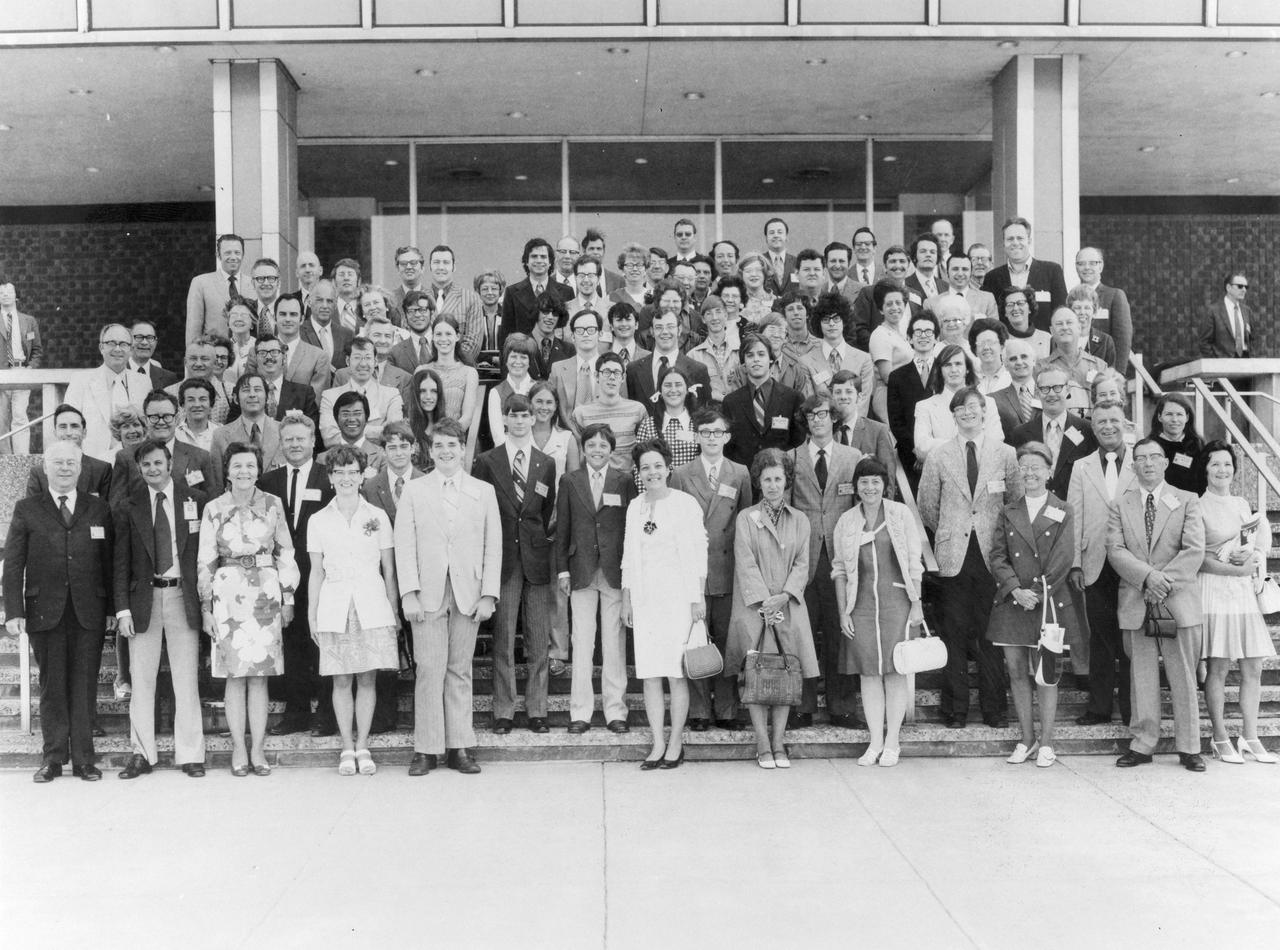 One of the most successful of the Skylab educational efforts was the Skylab Student Project. A nationwide scientific competition was sponsored by the National Science Teachers Association and the National Aeronautics and Space Administration (NASA) in which secondary students were encouraged to submit proposals for experiments to be conducted on Skylan in Earth orbit the following year. After the official announcement of this project, over 4,000 students responded with 3,409 proposals. The winning 25 students, along with their parents and sponsor teachers, visited Marshall Space Flight Center (MSFC), the lead center for Skylab, where they met with scientists and engineers, participated in design reviews for their experiments, and toured MSFC facilities. Of the 25 students, 6 did not see their experiments conducted on Skylab because the experiments were not compatible with Skylab hardware and timelines. Of the 19 remaining, 11 experiments required the manufacture of additional equipment.  This photograph is a group shot of the 25 winners, parents, and sponsors when they met for the first time on the steps of Building 4200 at MSFC in the Spring of 1972. 