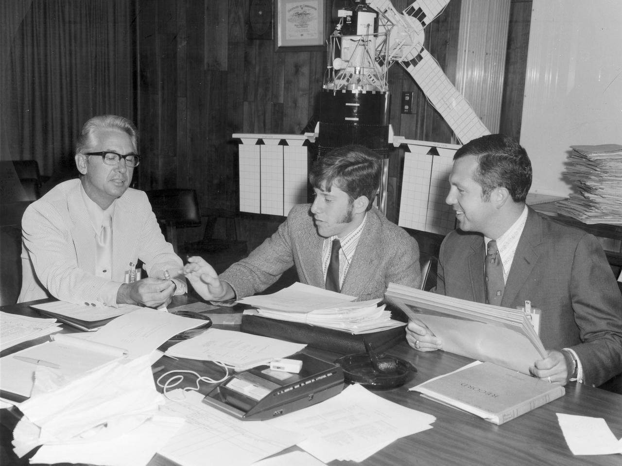 Todd Meister(center), high school student of the Bronx High School of Science, discusses his experiment “An Invitro Study of Selected Isolated Immune Phenomena” with his advisor, Dr. Robert Allen (right) and Henry Floyd, both of the Marshall Space Flight Center (MSFC).  His experiment was aimed at discovering whether or not the absence of gravity affects the representative life processes. Meister was one of the 25 winners of a contest in which some 3,500 high school students proposed experiments for the following year’s Skylab mission. Of the 25 students, 6 did not see their experiments conducted on Skylab because the experiments were not compatible with Skylab hardware and timelines. Of the 19 remaining, 11 experiments required the manufacture of equipment.