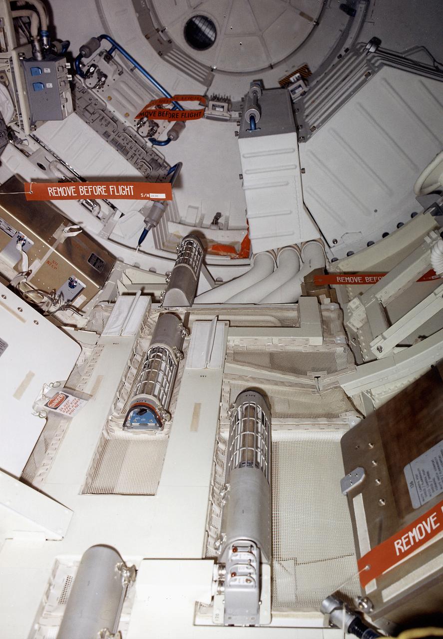 This September 1972 photograph shows the internal configuration of Skylab's Multiple Docking Adapter (MDA) flight article as it appeared during the Crew Compartment and Function Review at the Martin-Marietta Corporation's Space Center facility in Denver, Colorado. Designed and manufactured by the Marshall Space Flight Center, the MDA housed a number of experiment control and stowage units and provided a docking port for the Apollo Command Module. 