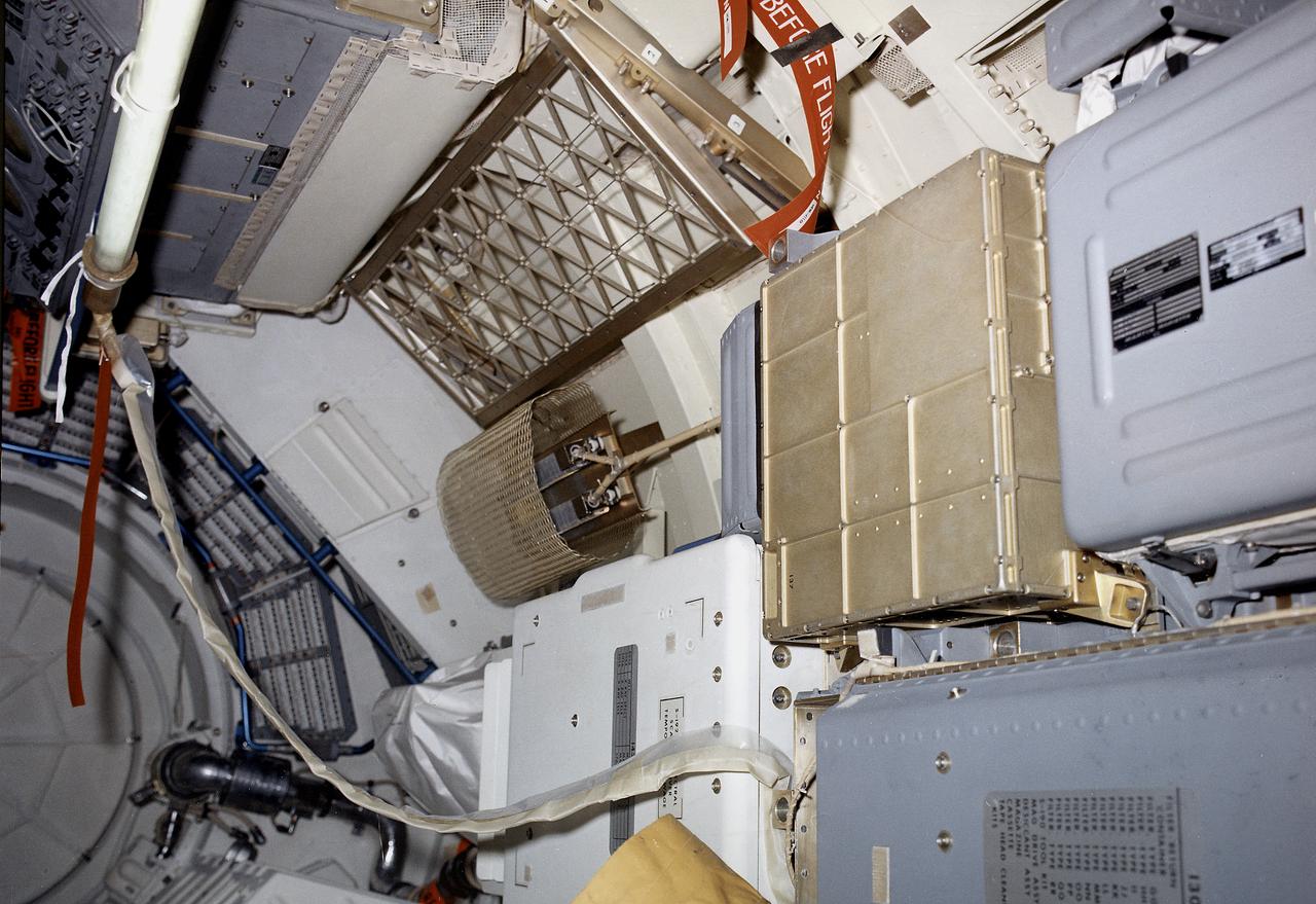 The Multiple Docking Adapter (MDA), designed and constructed under the direction of the Marshall Space Flight Center, was one of four principal sections comprising Skylab. The MDA provided the means by which the Command and Service Modules attached to the Skylab, enabling the crews to enter and work in it. Also included in the MDA was a control and display console for the Apollo Telescope Mount. This image shows an interior view of the MDA.