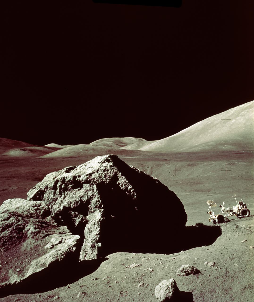 In this Apollo 17 onboard photo, a Lunar Roving Vehicle (LRV) is parked beside a huge boulder near the Valley of Tourus-Litttrow on the lunar surface. The seventh and last manned lunar landing and return to Earth mission, the Apollo 17, carrying a crew of three astronauts: Mission Commander Eugene A. Cernan; Lunar Module pilot Harrison H. Schmitt; and Command Module pilot Ronald E. Evans, lifted off on December 7, 1972 from the Kennedy Space Flight Center (KSC). Scientific objectives of the Apollo 17 mission included geological surveying and sampling of materials and surface features in a preselected area of the Taurus-Littrow region, deploying and activating surface experiments, and conducting in-flight experiments and photographic tasks during lunar orbit and transearth coast (TEC). These objectives included: Deployed experiments such as the Apollo lunar surface experiment package (ALSEP) with a Heat Flow experiment, Lunar seismic profiling (LSP), Lunar surface gravimeter (LSG), Lunar atmospheric composition experiment (LACE) and Lunar ejecta and meteorites (LEAM). The mission also included Lunar Sampling and Lunar orbital experiments. Biomedical experiments included the Biostack II Experiment and the BIOCORE experiment. The mission marked the longest Apollo mission, 504 hours, and the longest lunar surface stay time, 75 hours, which allowed the astronauts to conduct an extensive geological investigation. They collected 257 pounds (117 kilograms) of lunar samples with the use of the Marshall Space Flight Center developed LRV. The mission ended on December 19, 1972