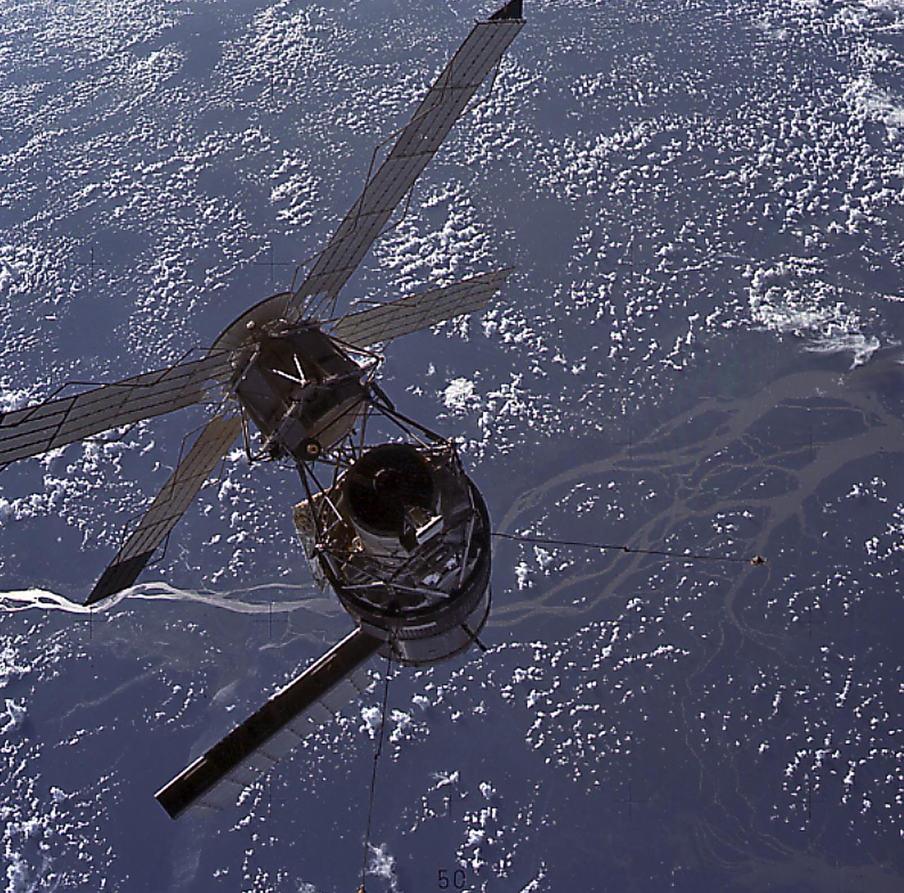This striking image of Skylab was photographed by Astronaut Jack Lousma (Skylab-3), as the second crew reached the orbiting laboratory over the delta of the mighty Amazon River. Skylab's solar arrays were exposed directly to the Sun's rays. Solar energy was transformed into electrical power for operation of all spacecraft systems. The proper operation of these solar arrays was vital to the mission. 