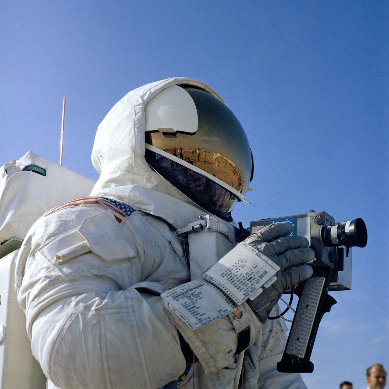 CAPE CANAVERAL, Fla. - Astronaut Fred W. Haise Jr., Apollo 13 lunar module pilot, practices operation of the 16-millimeter motion picture camera to be used on the lunar surface during the Apollo 13 mission. The Apollo 13 landing is scheduled for the Fra Mauro, a highlands area approximately 95 miles east of the Apollo 12 landing site in November 1969. Apollo 13, scheduled for launch from Kennedy Space Center on April 11, has a prime crew composed of Haise, James A. Lovell Jr., commander, and Thomas K. Mattingly II, command module pilot. Photo credit: NASA