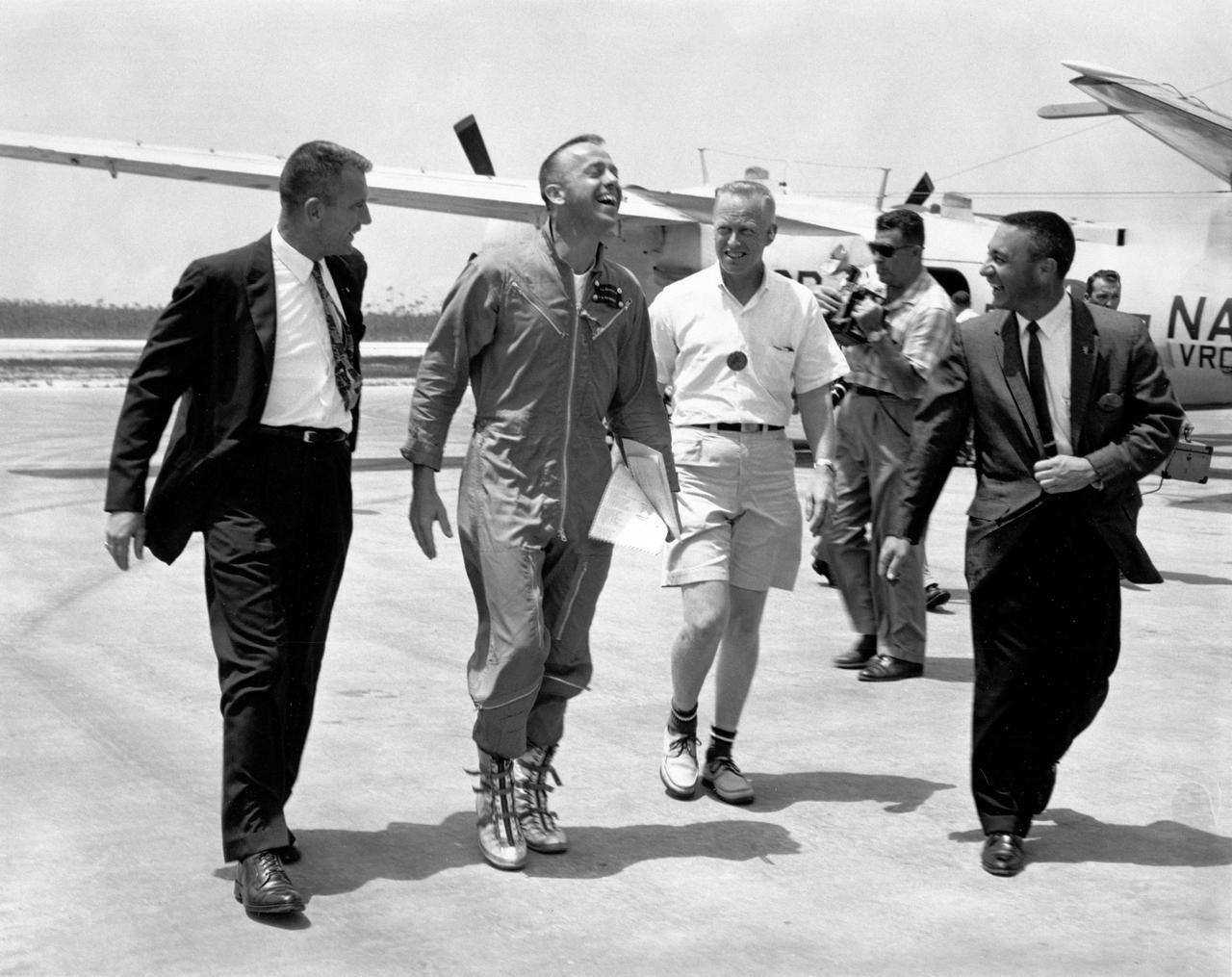 KENNEDY SPACE CENTER, FLA. - Astronauts Deke Slayton, far left, and Virgil Grissom, far right, were on hand to greet Astronaut Alan B. Shepard at Grand Bahama Island after his historic first U.S. manned suborbital flight.  Just behind Astronaut Shepard is Dr. Keith Lyndell.