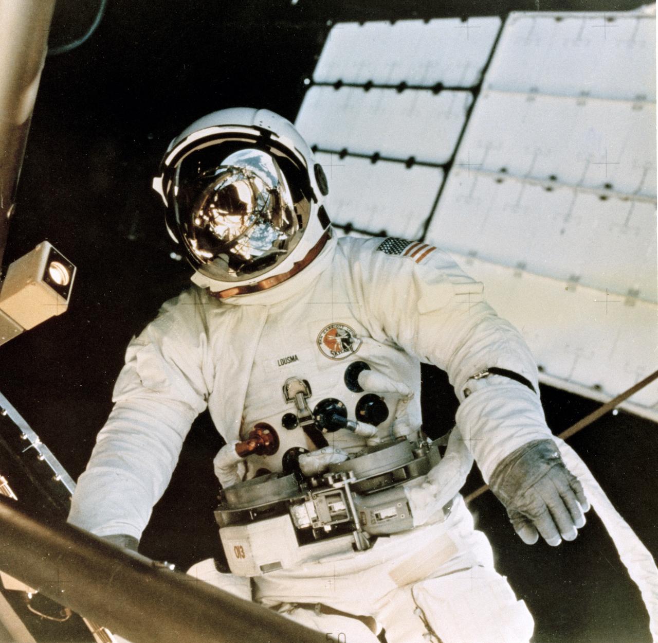 Skylab-3 was the second marned mission in the skylab project. The crew spent 59 days in orbit. In this photo, Astronaut Jack Lousma deploys the Twin Pole Sun Shield created by Marshall Space Flight Center team members to replace the micrometeoroid shield, a thin protective cylinder surrounding the workshop protecting it from tiny space particles and the sun's scorching heat. The shield was damaged during the Skylab-2 mission.