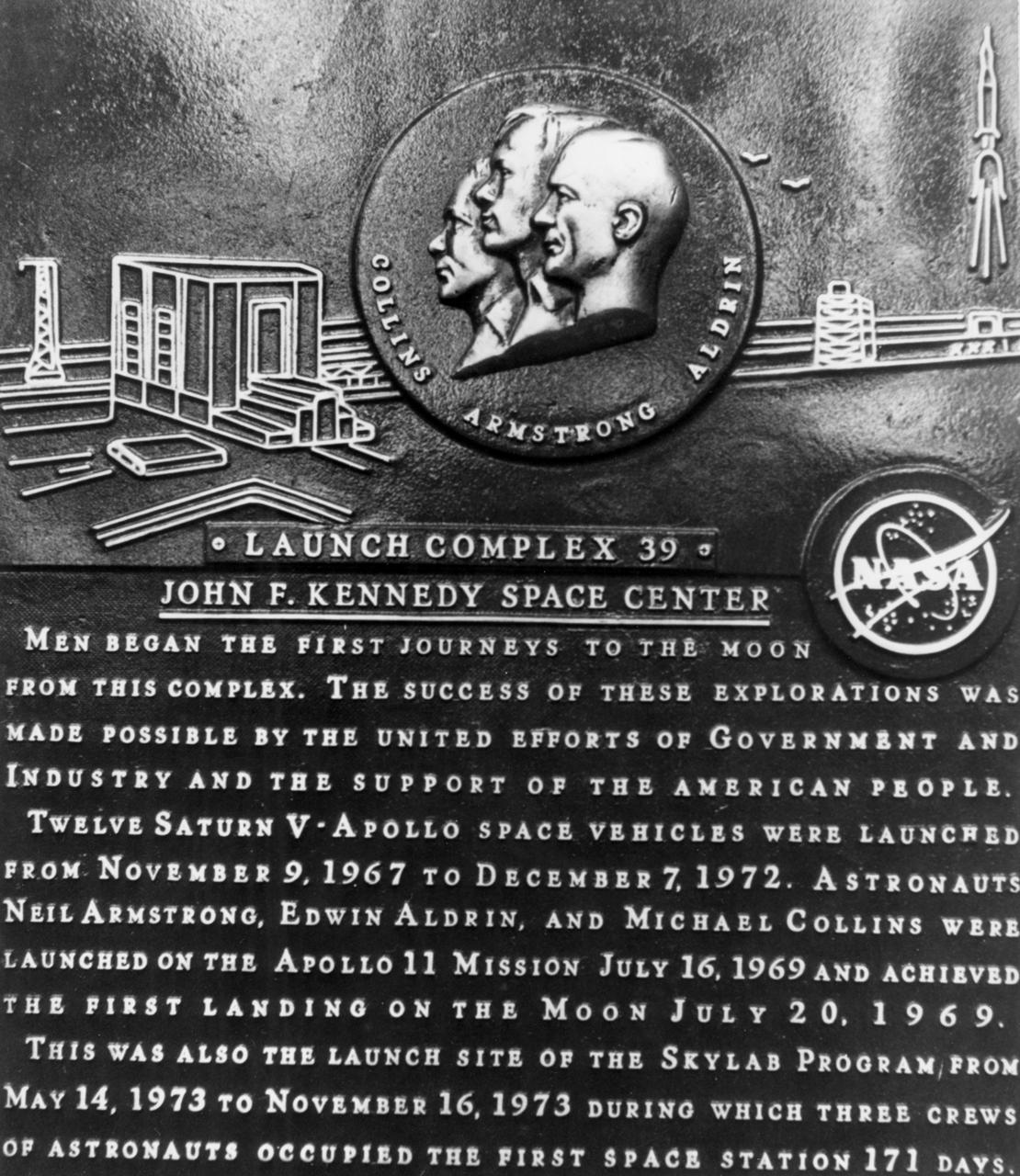 On July 3, 1974 NASA commemorated the 5th anniversary of the Apollo 11, first lunar landing mission, at the Kennedy Space Center (KSC). Launch Pad 39, from which astronauts Neil Armstrong, Edwin Aldrin, and Michael Collins first embarked on their historic journey to the Moon, was dedicated as a national landmark. Apollo 11 was launched at 9:32 am on July 16, 1969 and made the first successful lunar landing July 20th. During the 45 minute ceremony, the three Apollo 11 astronauts unveiled this plaque which was placed at the launch site. Other participating dignitaries included Dr. James Fletcher and Dr. George H. Low, NASA Administrator and Deputy Administrator respectively; Florida Governor Rubin Askew; Senator frank E. Moss; Congressman Olin E. Teague, and Kurt Debus, KSC Director. Apollo 11 launched from the Kennedy Space Center, Florida via a Saturn V launch which was developed by the Marshall Space Flight Center (MSFC) under the direction of Dr. Wernher von Braun.  