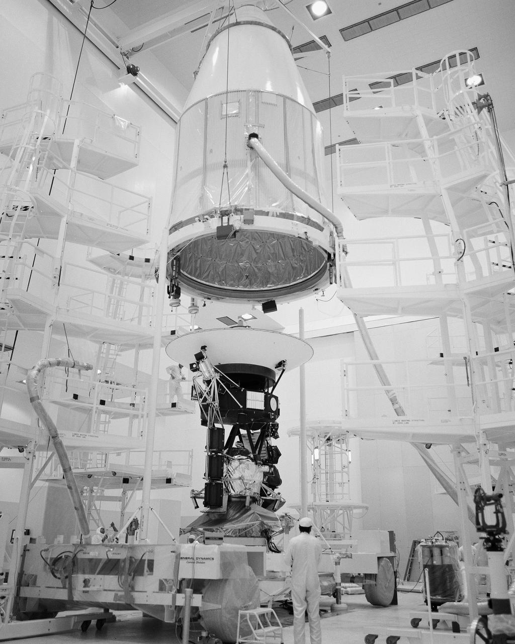 CAPE CANAVERAL, Fla. -- At the Spacecraft Assembly and Encapsulation Facility-1 at the Kennedy Space Center in Florida, the Voyager spacecraft for the first of two missions to be launched toward the outer planets was encapsulated within the payload fairing which will protect it during launch. The 1,800 pound spacecraft is to be mated with Titan_Centaur 7 at Launch Complex 41 and sent on a mission to Jupiter and Saturn no earlier than Aug. 20, 1977. Photo Credit: NASA