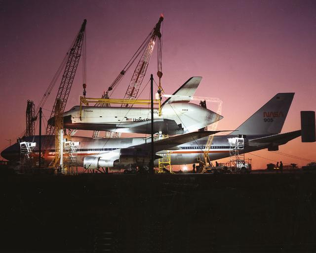 The Shuttle Orbiter Enterprise is off-loaded at Redstone Arsenal Airfield for later Mated Vertical Ground Vibration tests (MVGVT) at Marshall Space Flight Center's Dynamic Test Stand. The tests marked the first time ever that the entire shuttle complement (including orbiter, external tank, and solid rocket boosters) were mated vertically.