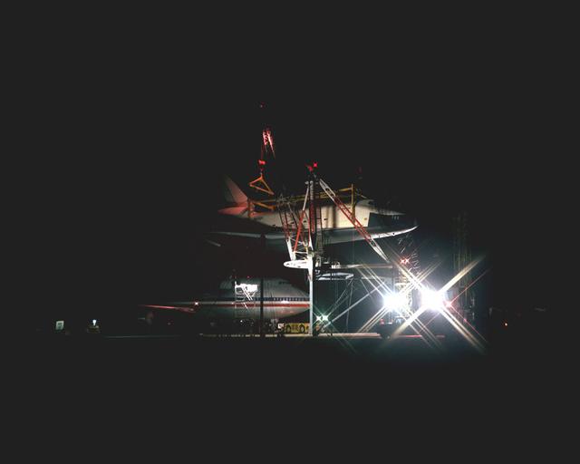 The Shuttle Orbiter Enterprise is off-loaded Redstone Arsenal Airfield for later Mated Vertical Ground Vibration tests (MVGVT) at Marshall Space Flight Center's Dynamic Test Stand. The tests marked the first time ever that the entire shuttle complement (including orbiter, external tank, and solid rocket boosters) were mated vertically.