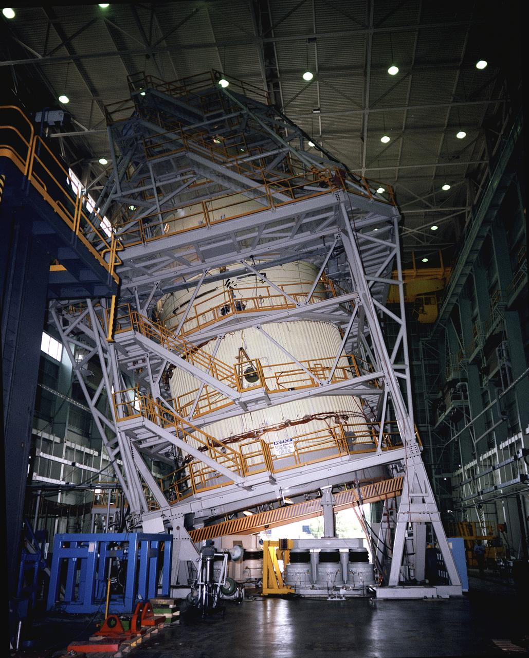 This photograph shows a liquid oxygen tank for the Shuttle External Tank (ET) during a hydroelastic modal survey test at the Marshall Space Flight Center. The ET provides liquid hydrogen and liquid oxygen to the Shuttle's three main engines during the first 8.5 minutes of flight. At 154-feet long and more than 27-feet in diameter, the ET is the largest component of the Space Shuttle, the structural backbone of the entire Shuttle system, and is the only part of the vehicle that is not reusable. The ET is manufactured at the Michoud Assembly Facility near New Orleans, Louisiana, by the Martin Marietta Corporation under management of the Marshall Space Flight Center.