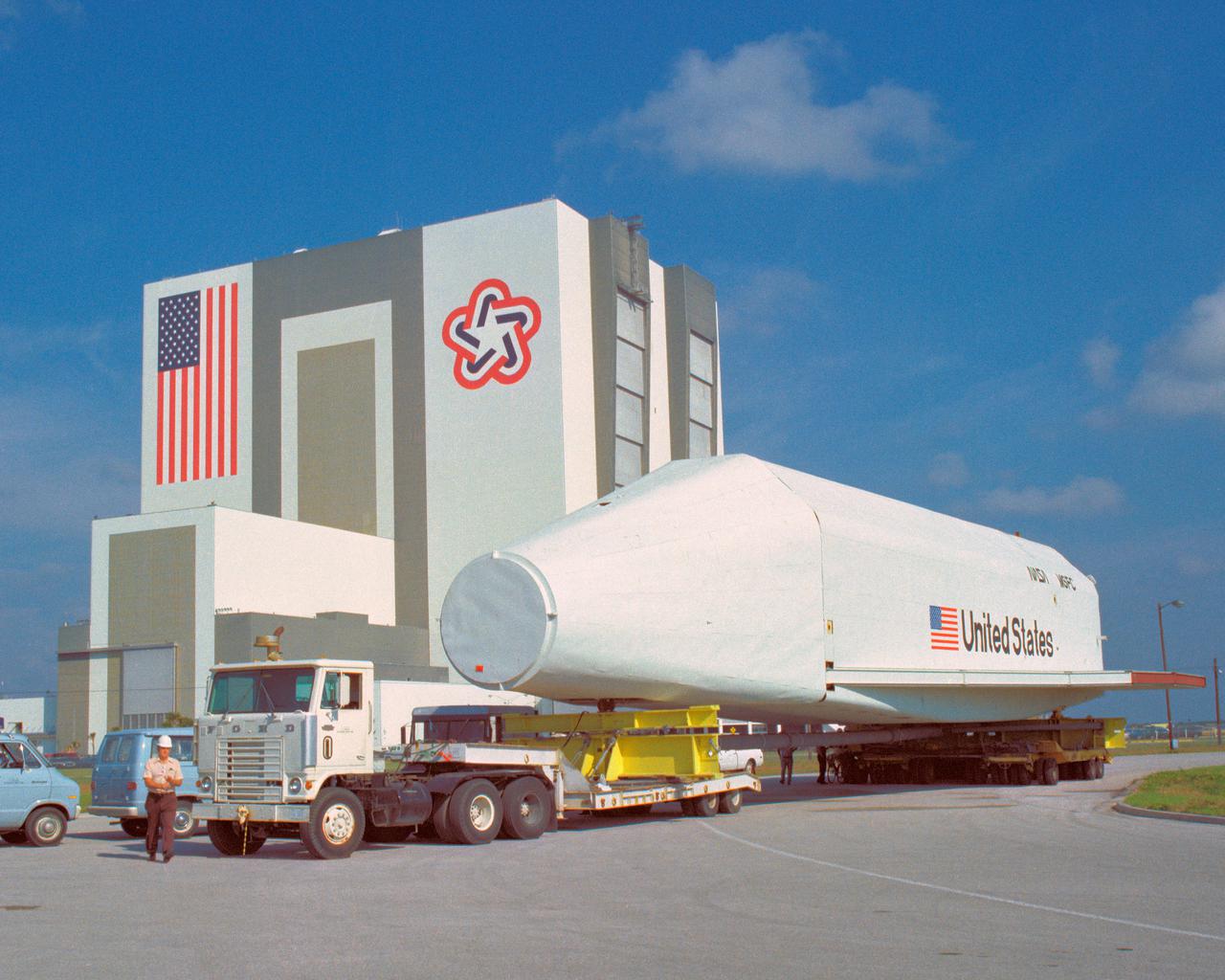 CAPE CANAVERAL, Fla. – At NASA's Kennedy Space Center in Florida, the space shuttle mock-up, dubbed Pathfinder, makes its trek from the turn basin to the Vehicle Assembly Building on April 5, 1978. The mock-up, constructed at NASA's Marshall Space Flight Center in Huntsville, Ala., possessed the general dimensions, weight and balance of a real space shuttle. It was shipped to Kennedy by barge and then used to fit-check the work platforms of the Mate-Demate Device, orbiter processing facilities and Vehicle Assembly Building, as well as support ground crew training. It also was used to rehearse post-landing procedures at Kennedy's Shuttle Landing Facility.  After being on display at the 'Great Space Shuttle Exposition' in Tokyo from June 1983 to August 1984, the mock-up returned to Marshall and now is on permanent display at the U.S. Space and Rocket Center near Huntsville. Photo credit: NASA