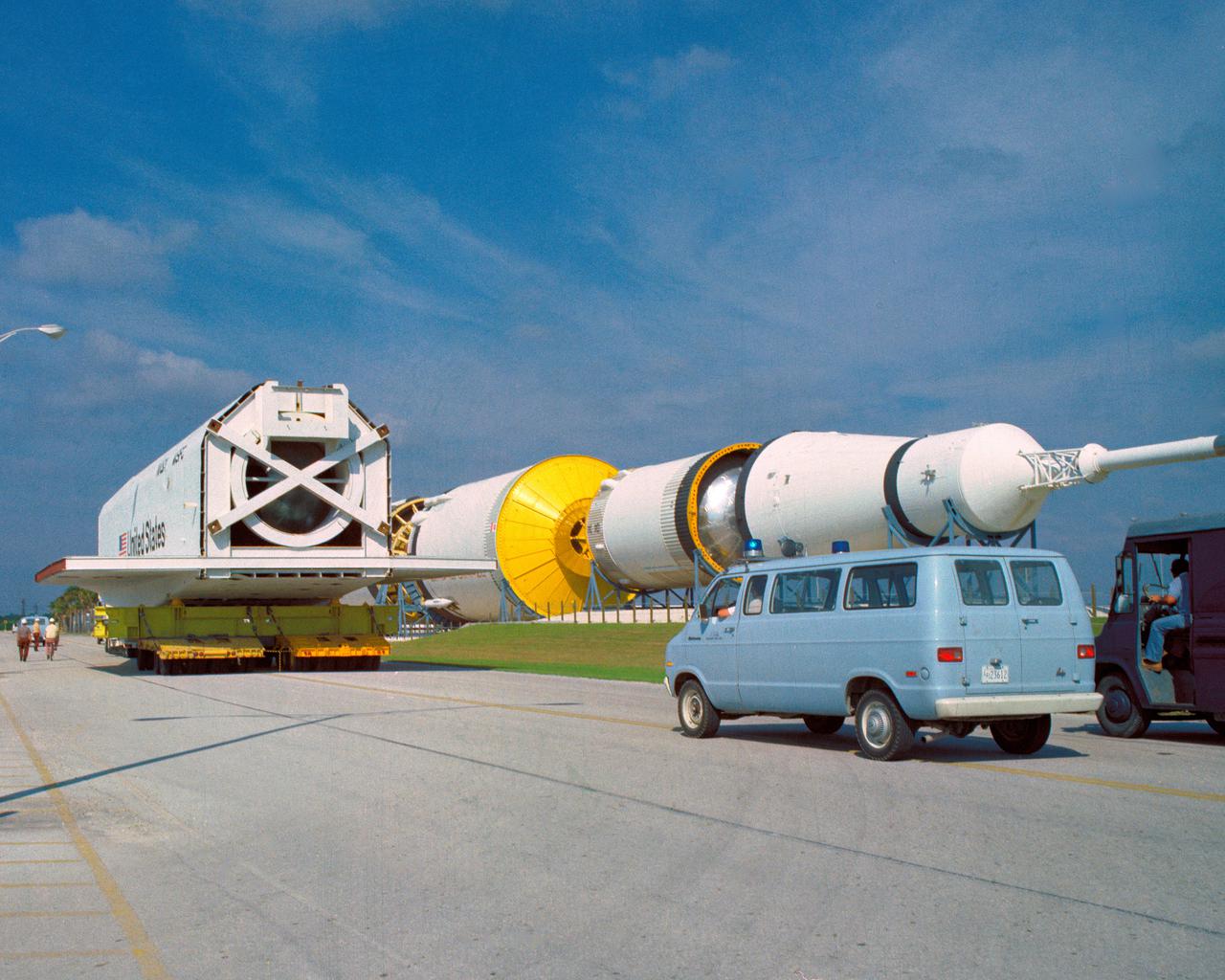 CAPE CANAVERAL, Fla. – At NASA's Kennedy Space Center in Florida, the space shuttle mock-up, dubbed Pathfinder, makes its trek from the turn basin to the Vehicle Assembly Building on April 5, 1978. The mock-up, constructed at NASA's Marshall Space Flight Center in Huntsville, Ala., possessed the general dimensions, weight and balance of a real space shuttle. It was shipped to Kennedy by barge and then used to fit-check the work platforms of the Mate-Demate Device, orbiter processing facilities and Vehicle Assembly Building, as well as support ground crew training. It also was used to rehearse post-landing procedures at Kennedy's Shuttle Landing Facility.  After being on display at the 'Great Space Shuttle Exposition' in Tokyo from June 1983 to August 1984, the mock-up returned to Marshall and now is on permanent display at the U.S. Space and Rocket Center near Huntsville. Photo credit: NASA